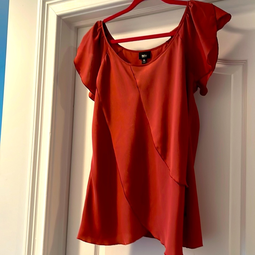 Burnt orange blouse. Silky material and flowing front with draped fabric.